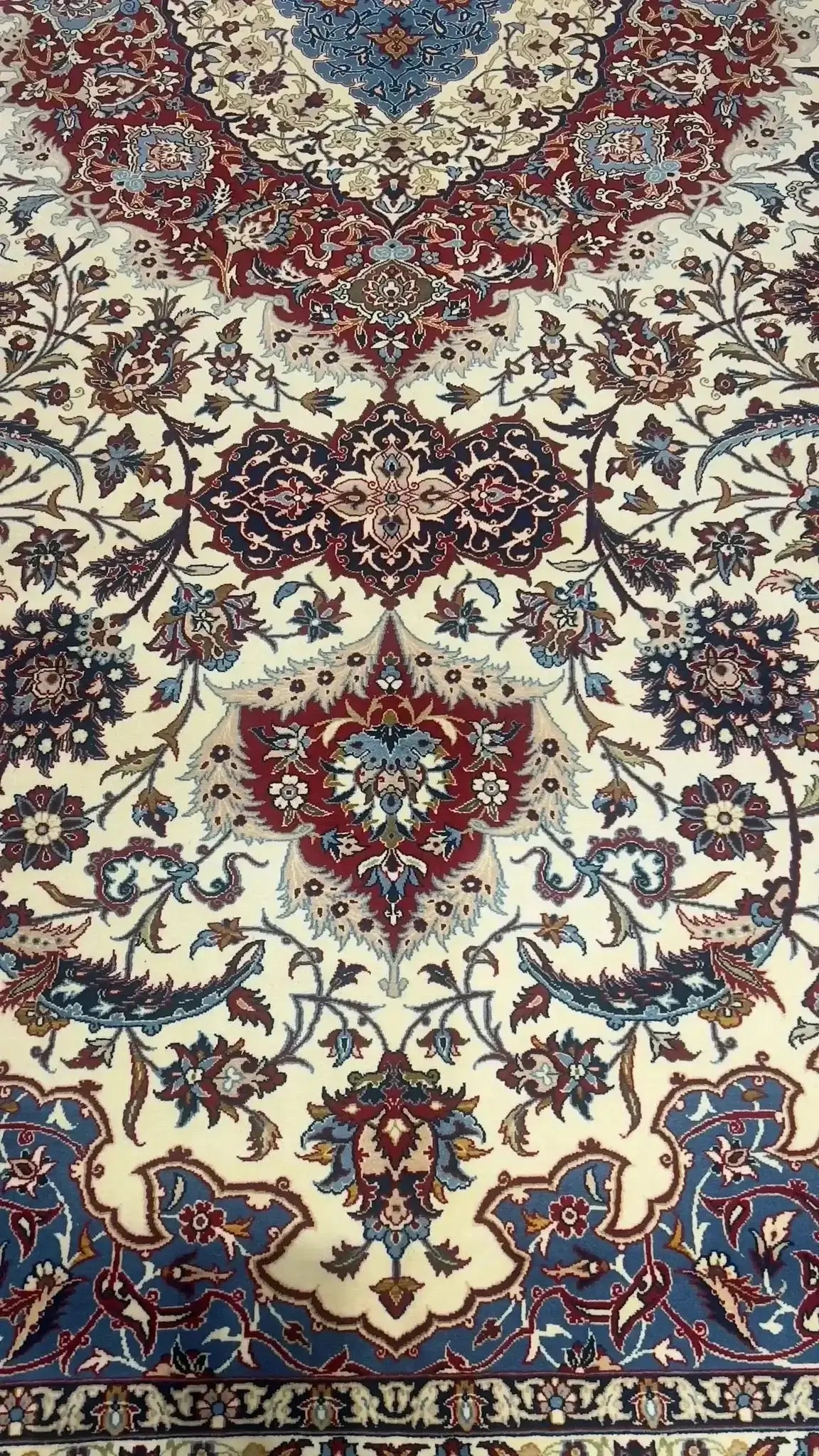 "Close-up of fine weave and colors on a Persian Isfahan rug."